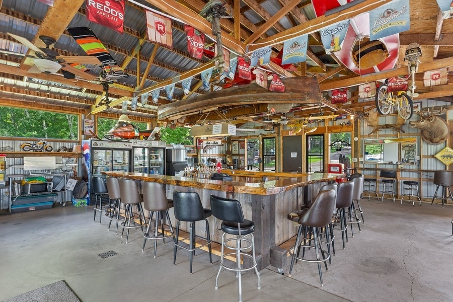 The Shed Bar with its wooden counter, open beams, and seating